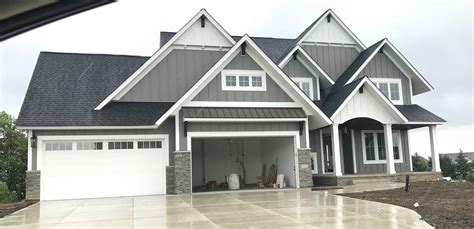 gray house white metal roof|white house charcoal trim.